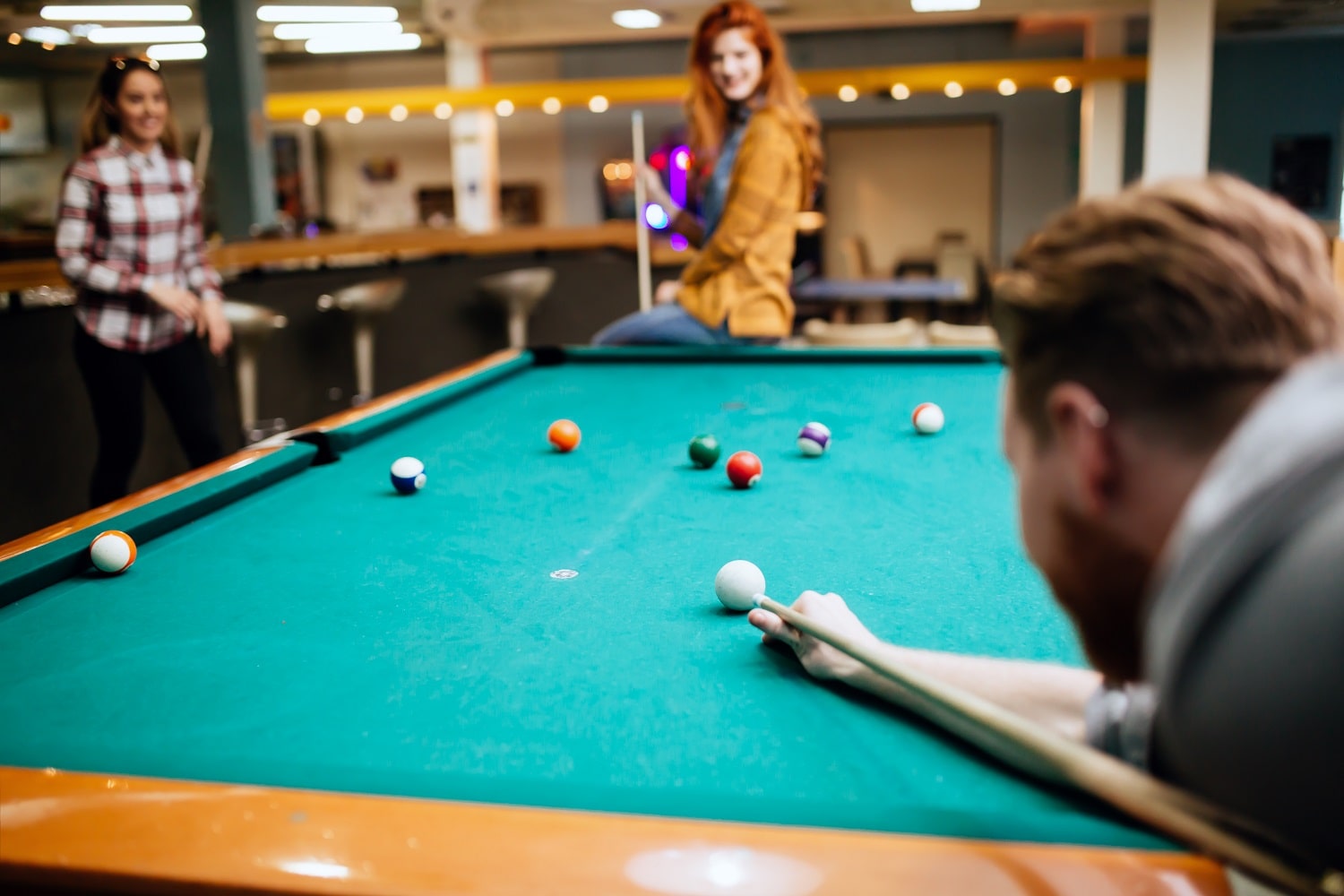 Friends playing snooker